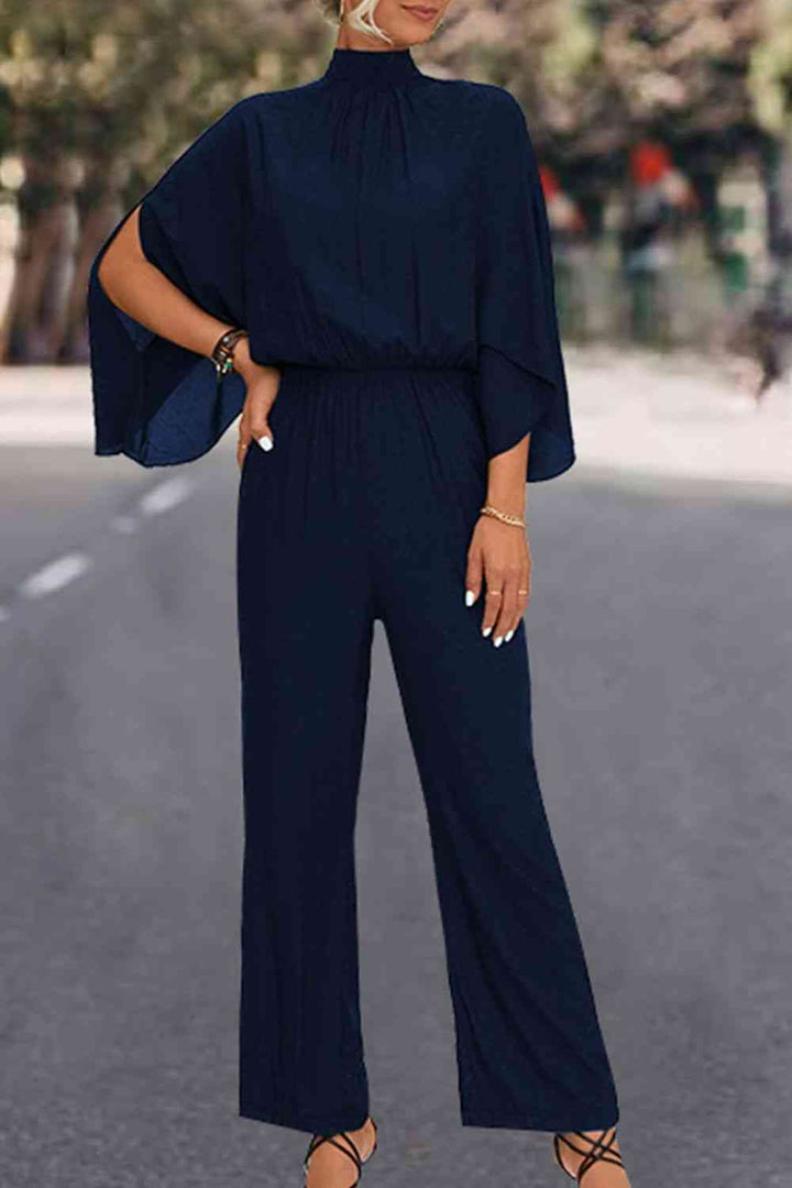 Elegante bloemenjumpsuit met hoge kraag en strikrug