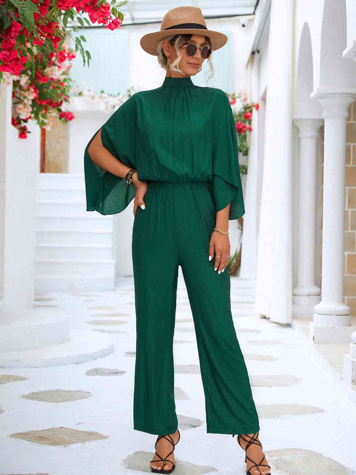 Elegante bloemenjumpsuit met hoge kraag en strikrug