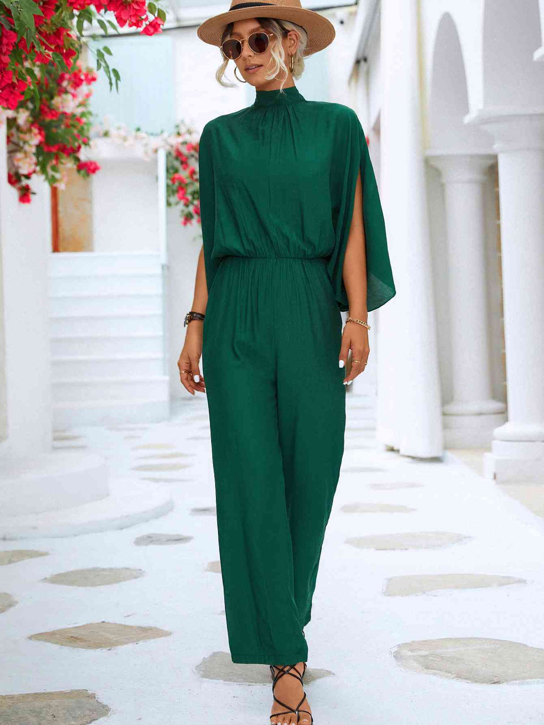 Elegante bloemenjumpsuit met hoge kraag en strikrug