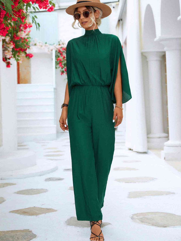 Elegante bloemenjumpsuit met hoge kraag en strikrug