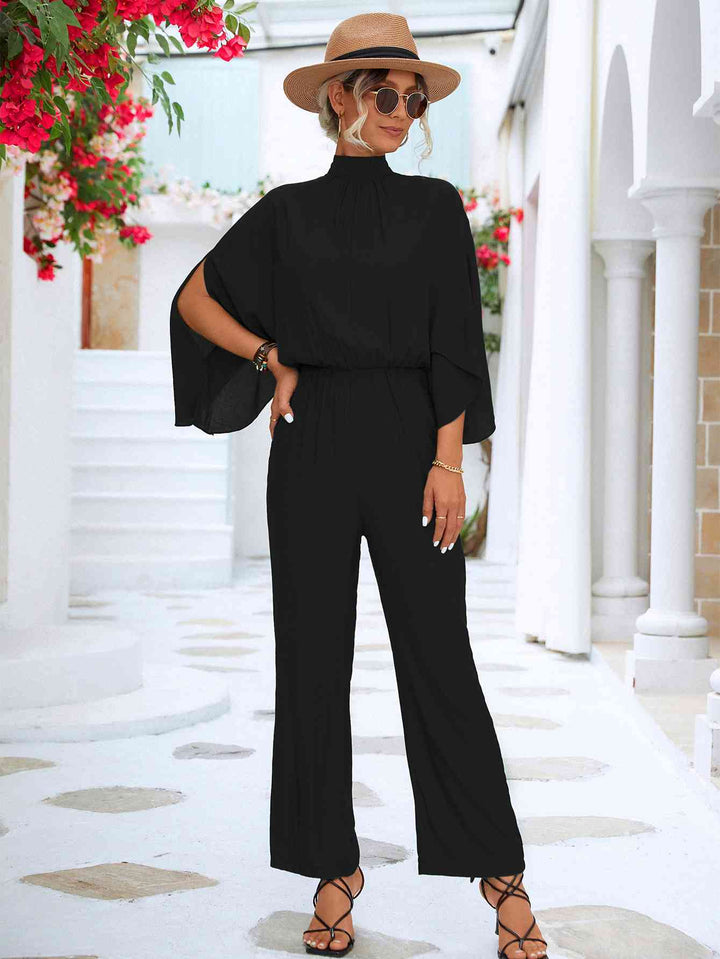 Elegante bloemenjumpsuit met hoge kraag en strikrug