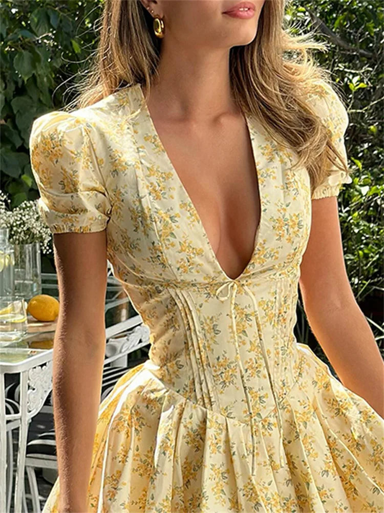 Romy zomerjurk voor dames | Korte bloemenjurk met pofmouwen & rugdecolleté met strik