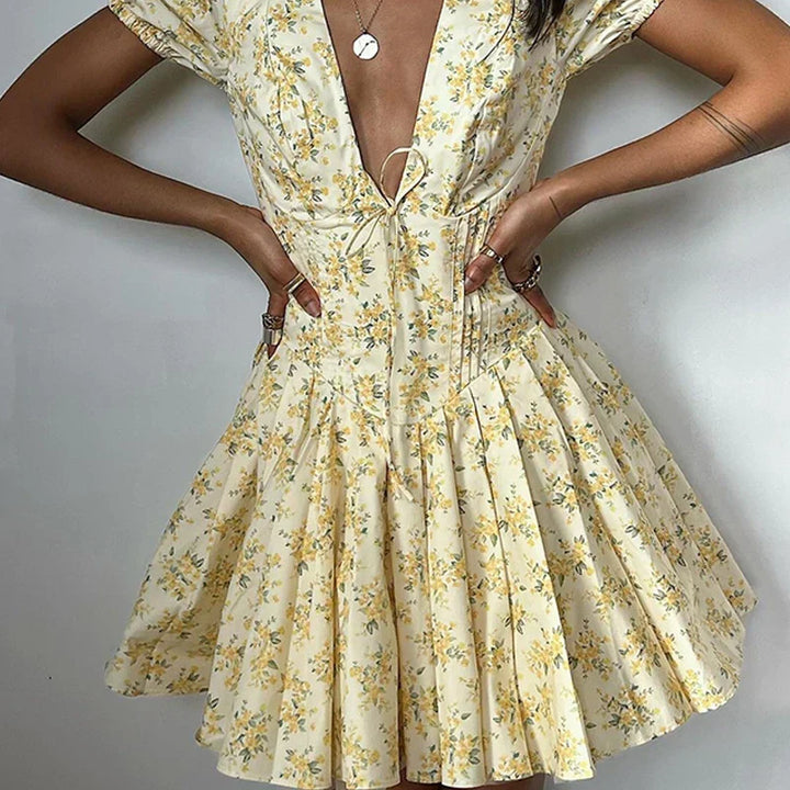Romy zomerjurk voor dames | Korte bloemenjurk met pofmouwen & rugdecolleté met strik