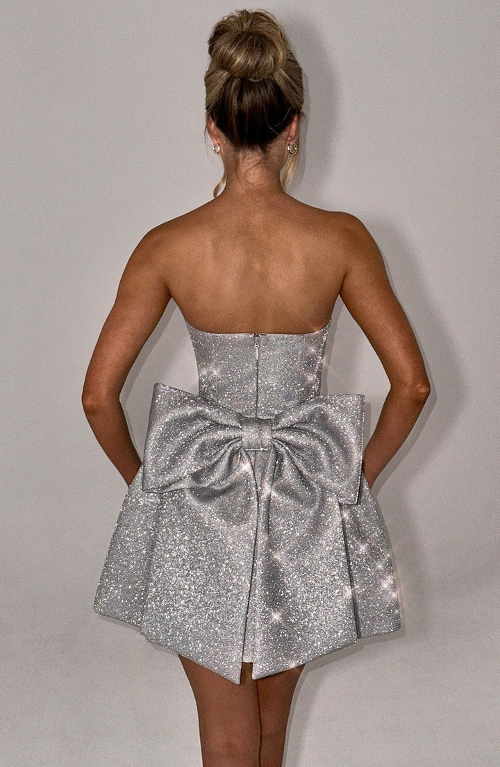 Paarse avondjurk voor dames | Lila-kleurige mini jurk met korsetveters & grote strik op de rug