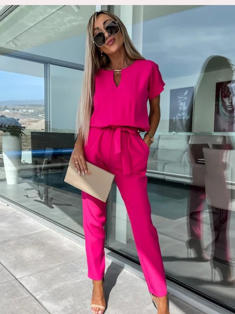Elara dames jumpsuit met V-hals | Elegant eendelig stuk met strik & wijde pijpen
