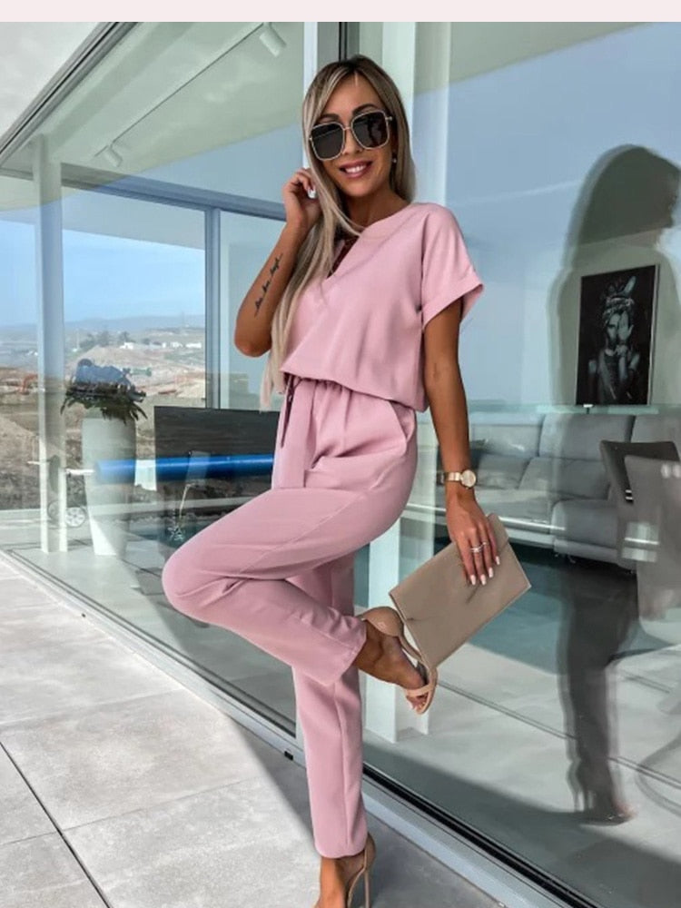 Elara dames jumpsuit met V-hals | Elegant eendelig stuk met strik & wijde pijpen