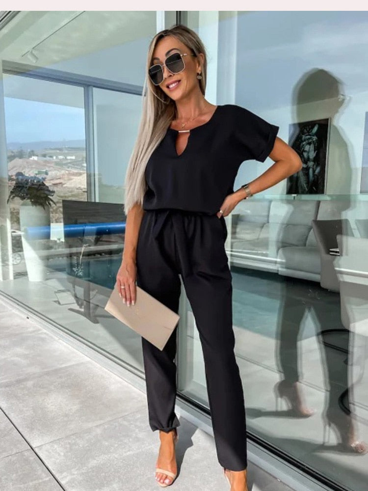 Elara dames jumpsuit met V-hals | Elegant eendelig stuk met strik & wijde pijpen